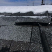 Winter Ice Damage ice lifting shingles then melting