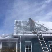 Winter Ice Damage leaf blower exposes shingles